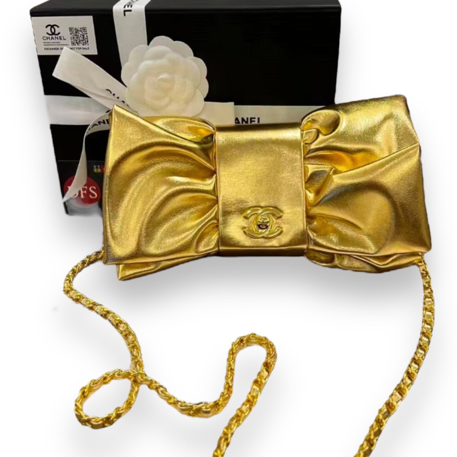 Chanel 24B Metallic Gold Bow Clutch Beaute Bag On Chain: • CHANEL• Bow• Metallic Gold • Clutch or Shoulder Carry • 9" x 4.5" (in)• Gold Tone Hardware• Signature CC Twist Lock Closure • Single Strap • Original Box