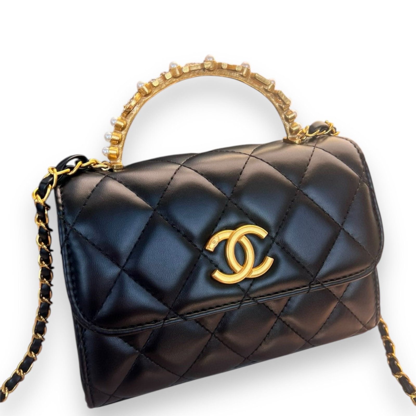 Black Pearl Handle CHANEL Top Handle Flap Beaute Bag: • CHANEL• Black• Gold Tone Hardware• Top Handle Flap Bag• Top Handle or Shoulder Carry• Gold Tone Hardware• 7” x 5” x (in)• Quilted Pattern • S