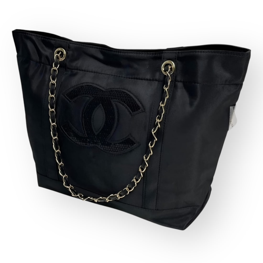 CHANEL Black On Black/Gold Sequin Logo Tote: • CHANEL • Black On Black • Certificate Of Authenticity Included • Gold Tone Hardware • Front Sequin CC Logo • Intertwined Leather Chain Strap • Shoulder Or Arm Carr