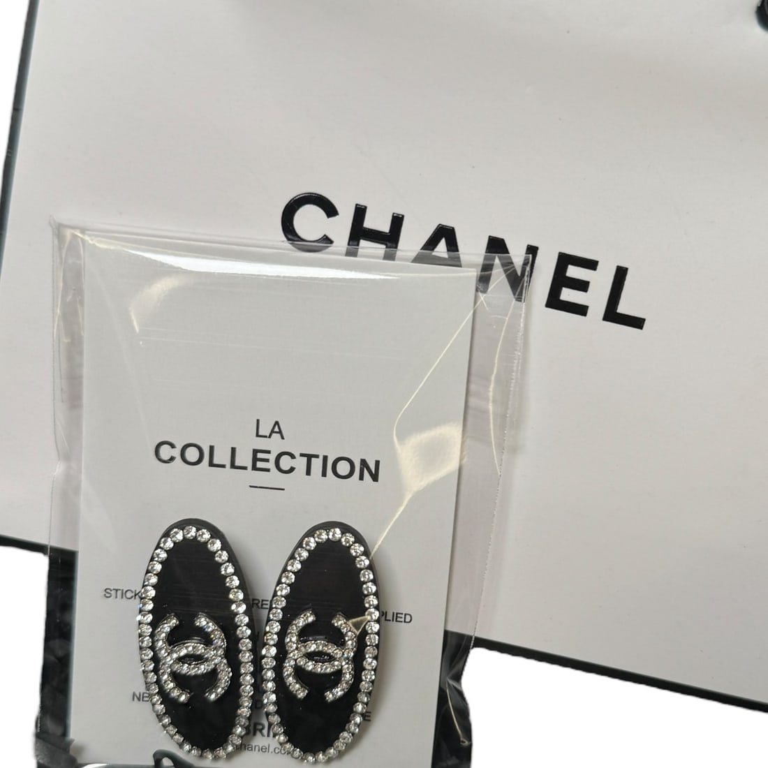 CHANEL 2PC Black/White Rhinestone CC Oval L.A Collection Hair Clips: • CHANEL• Gabrielle• 2Pc Set • Hair Clips• Black• White Rhinestone CC Logos• Gold Trim • Black Tone Hardware• Long Oval Shaped • L.A Collection•