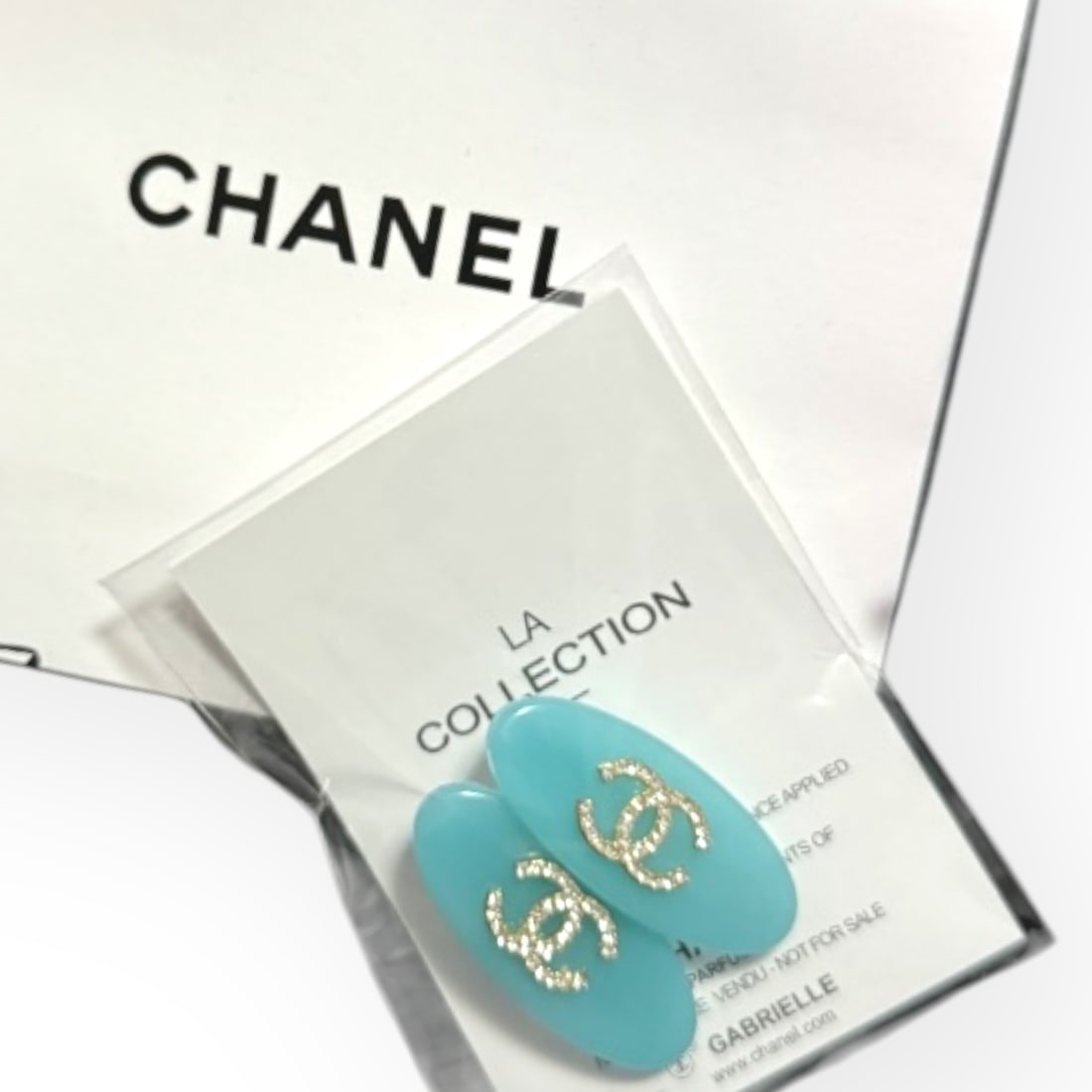 CHANEL 2Pc Teal/White Rhinestone CC Oval L.A Collection Hair Clips: • CHANEL • Gabrielle • 2Pc Set • Hair Clips • Teal • White Rhinestone CC Logo • Silver Tone Hardware • Oval Shaped • L.A Collection • Unopened/In Orig