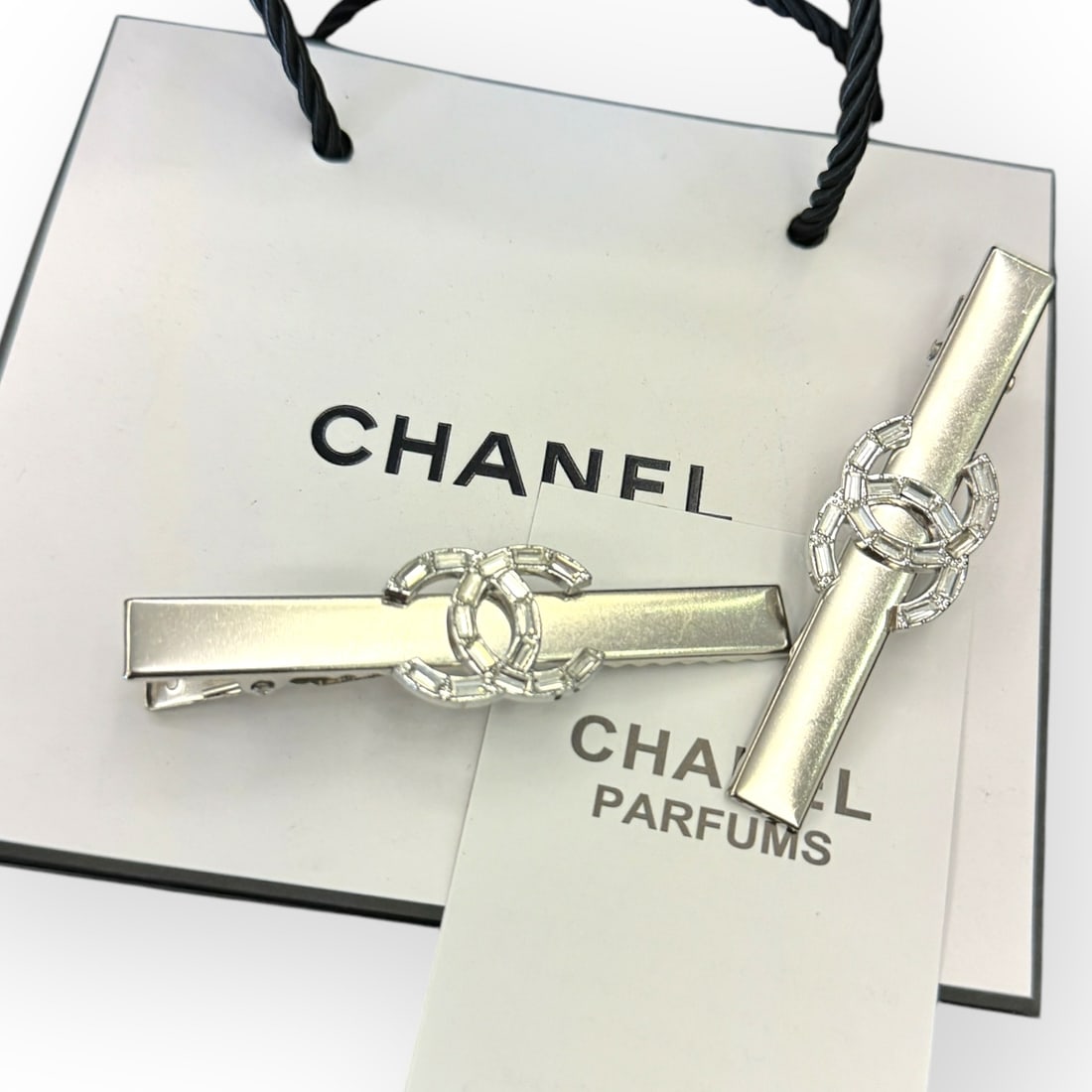 CHANEL 2Pc Set Silver/White Crystal CC Logo Long Rectangle L.A Collection Hair Clip: • CHANEL • 2Pc Set • Gabrielle • Silver • Hair Clip • Long Rectangle Shape • White Crystals CC Logo • Silver Tone Hardware • L.A Collection • Unopened