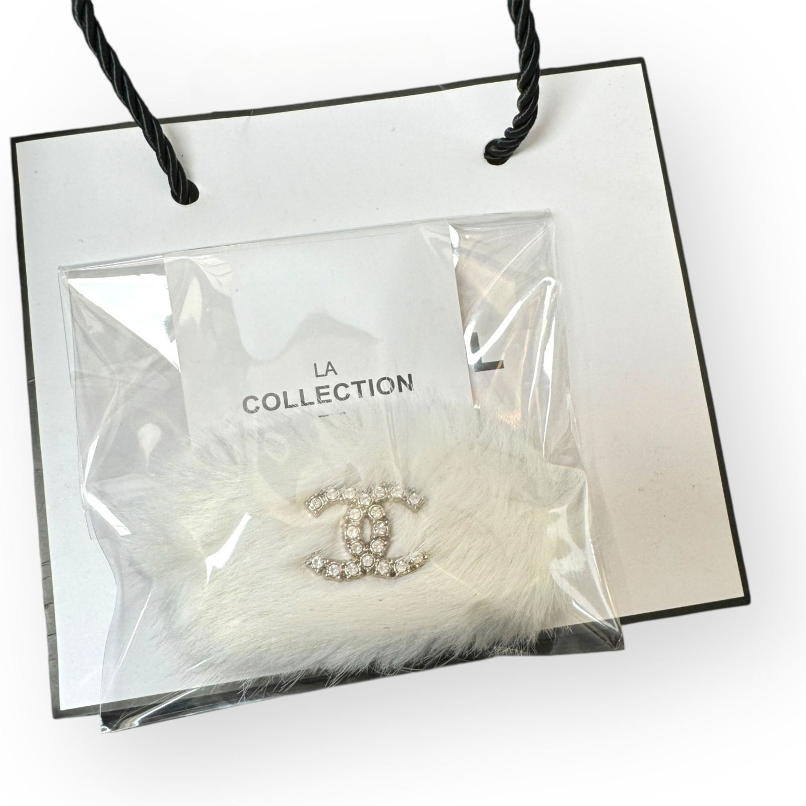 CHANEL White Fur White Rhinestone CC L.A Collection Hair Clip: • CHANEL• Gabrielle• Hair Clip• White Fur• White Rhinestone CC• Silver Trim• L.A Collection• Unopened/In Original Packaging • CHANEL Gift Bag Included