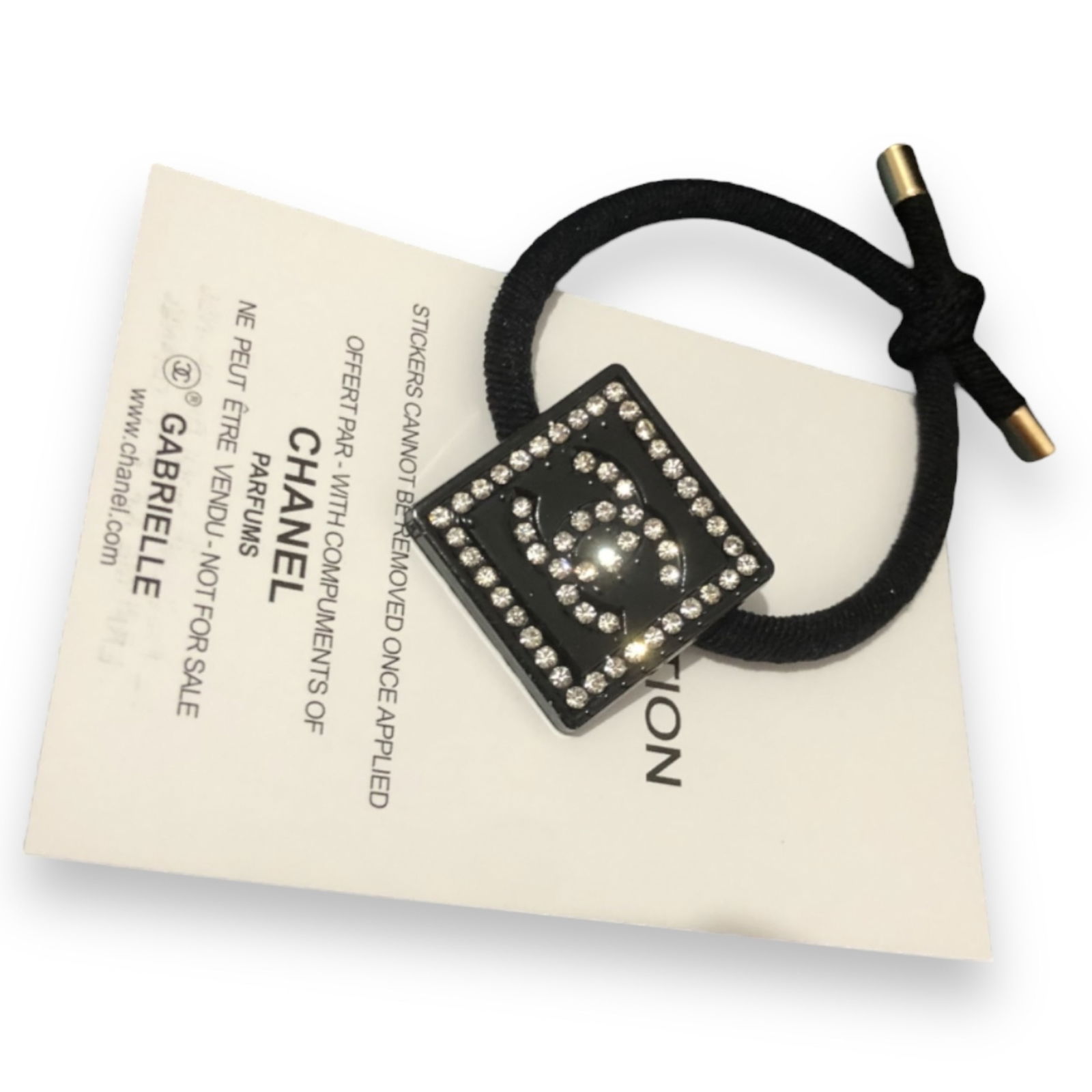 CHANEL Black/White Rhinestone Accented Squared CC L.A Collection Hair Tie: • CHANEL • Black• Squared• White Rhinestone Accents • Rhinestone CC Logo• Gabrielle L.A Collection• Hair Tie• Unopened/In Original Packaging • CHANEL Gift