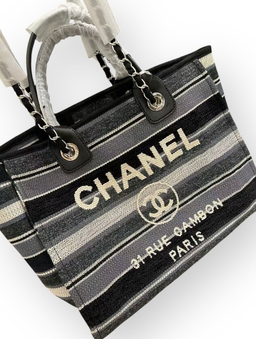 CHANEL LG Grey, Black, & White Striped Deauville Beaute Bag & Original CHANEL Gift Bag: • CHANEL• Grey, Black, & White• Striped Pattern • Silver Tone Hardware• Deauville Tote• 13” x 11” x (in)• Double Handles• Shoulder Straps• Orig