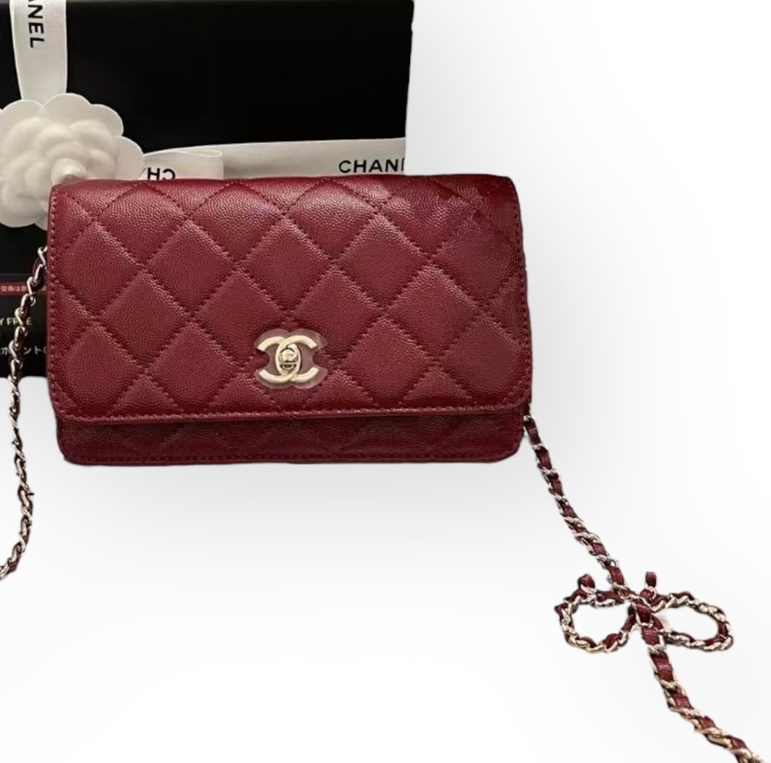 CHANEL Red Wallet On Chain Bow Strap Beaute Bag & Original Box: • CHANEL • Red • Quilted Pattern • Wallet On Chain (WOC) • Bow Accented Shoulder Strap • Intertwined Leather Chain Strap • Signature Twist Lock Closure • Interi