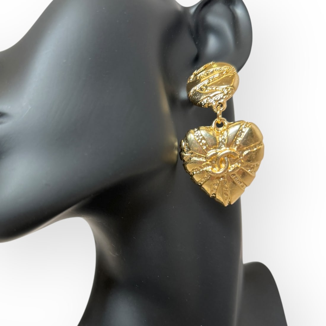 CHANEL Gold Heart Shaped Drop Earrings & Original Gift Bag: • CHANEL • Gold Tone Hardware • Earrings • Heart Shaped • Style: Drop • Front CC Logo • Striped Detail • Gabrielle • L.A. Collection • Original CHANEL