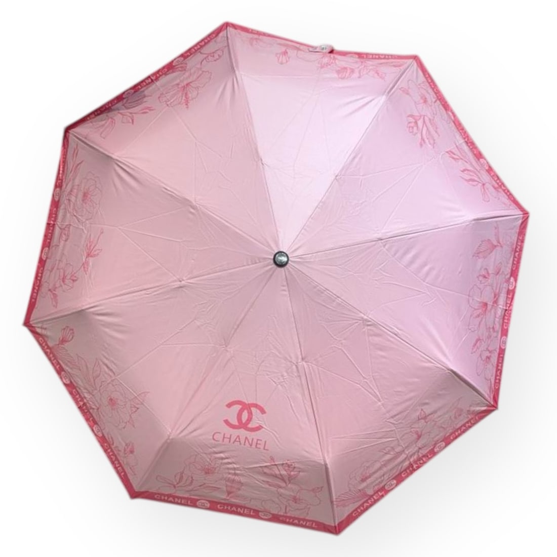 CHANEL Pink/Hot Pink Floral Print Beaute Umbrella & Original Storage Sleeve: • CHANEL • Pink • Floral Print • Hot Pink Accents • Front CHANEL/CC Logo • Black Handle • Handle Loop Making It Easy To Carry • Original Storage Sleeve Included