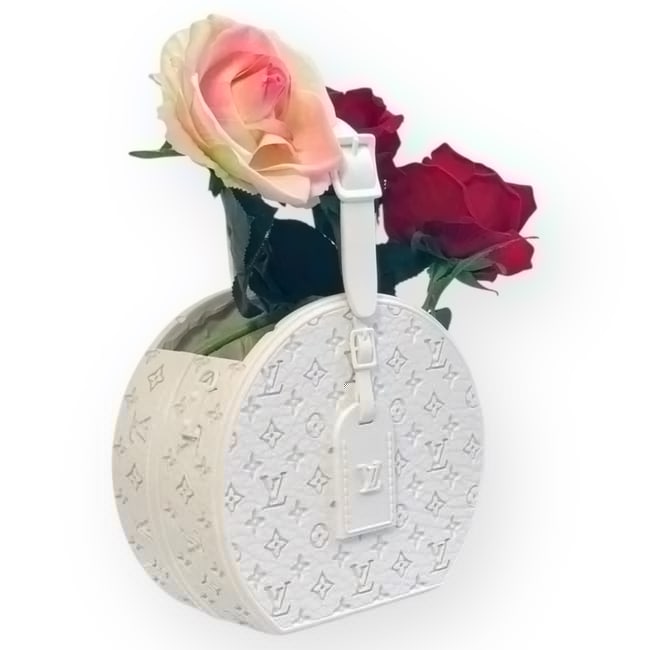 White Louis Vuitton Monogram Print Hat Box Flower Vase: • Louis Vuitton Inspired • Hatbox • Vase • White • Signature Monogram Pattern • LV Bag Tag Detail On The Vase With LV Logo • Makeup/Beaute Line: Please note that gwp