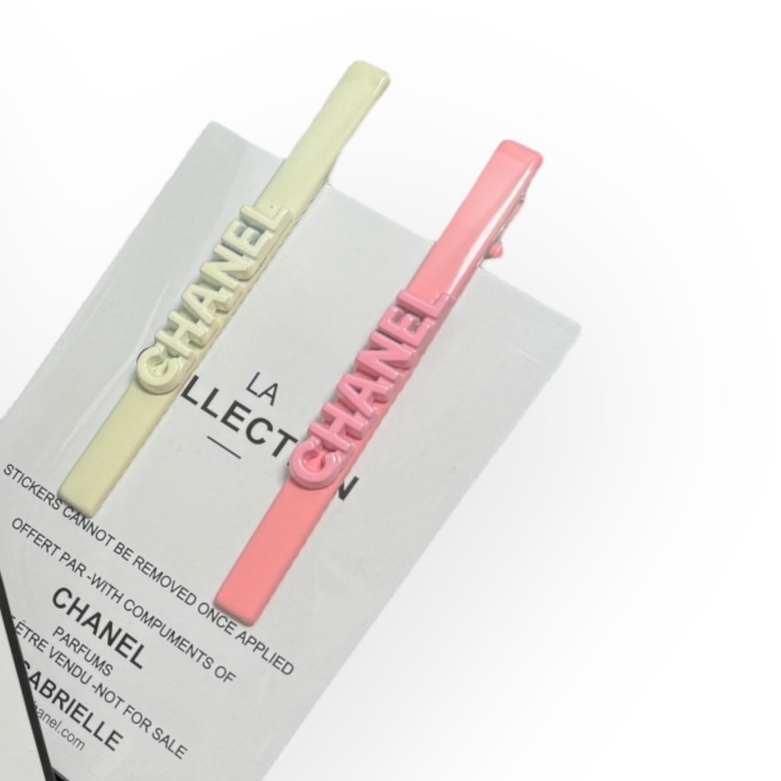 CHANEL2Pc Set Pink/White Long Skinny Rectangle Logo L.A. Collection Hair Clips: • CHANEL • Gabrielle • 2Pc Set • Hair Clips • Pink & White • Front CHANEL Logo • Shape: Long Skinny Rectangle • L.A Collection • Pink & White Tone Hardware