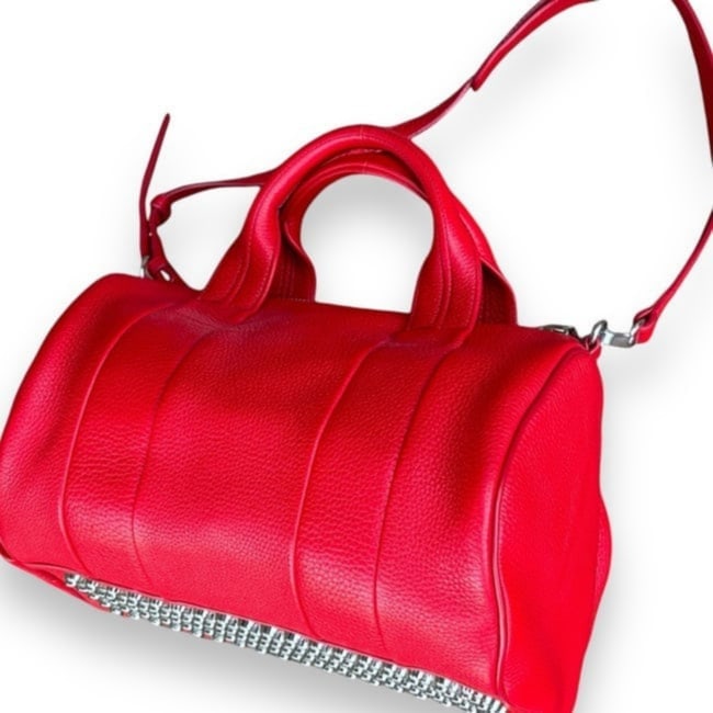 Alexander Wang Rockie Bag Red/Silver (Duffel Bag): • Alexander Wang • Rockie Bag • 13” x 9.5” x 7” (in) • Certificate Of Authenticity Included • Lambskin • Sturdy Studded Base • Top zip closure &bul