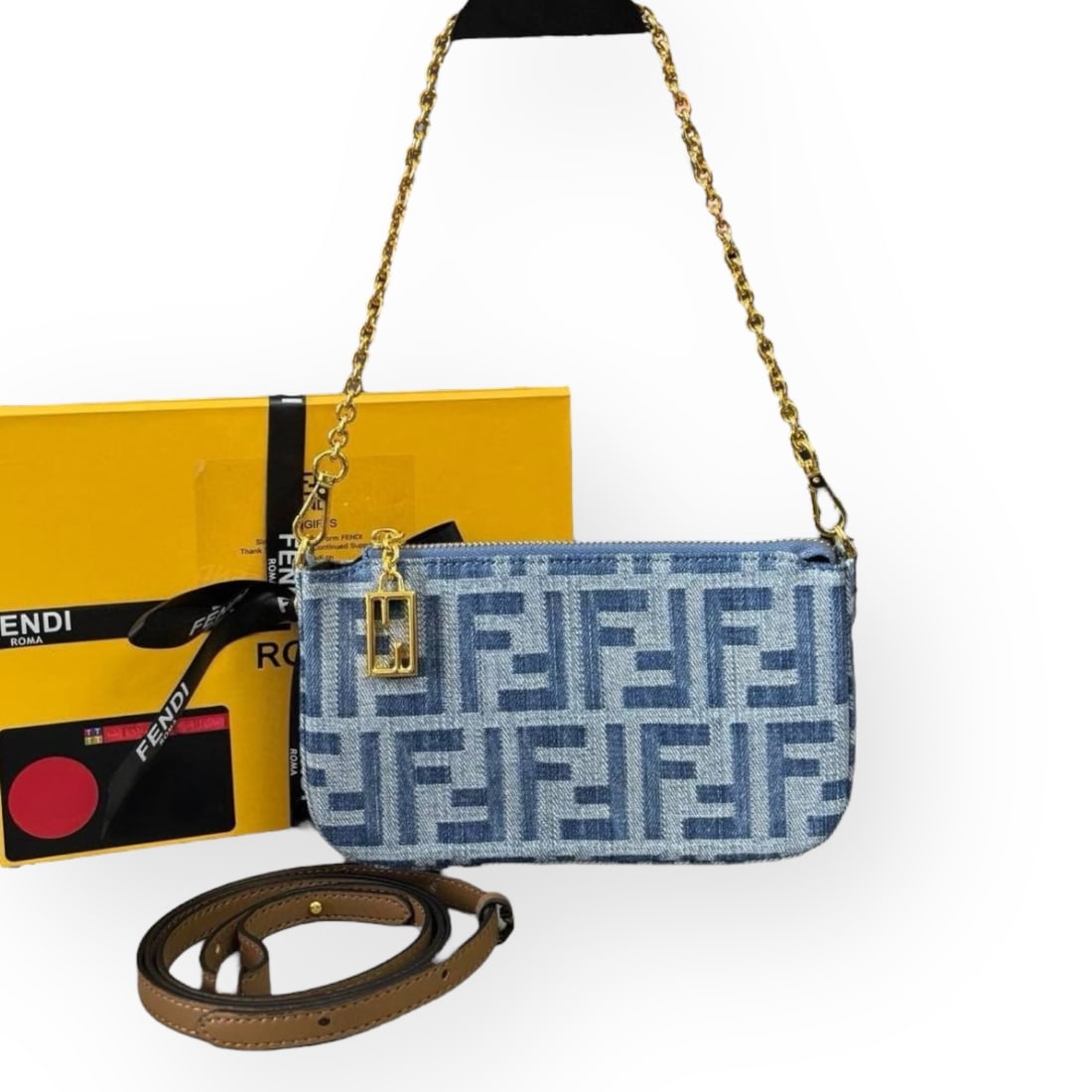 FENDI Blue Denim-Effect FF Jacquard Charm Pouch W/ Chain & Original Box: • FENDI • Blue Denim-Effect • FF Jacquard • Pouch W/ Chain • Gold Tone Hardware • Removable Chain Strap • Zip Closure • Additional Shoulder Strap Included &bull