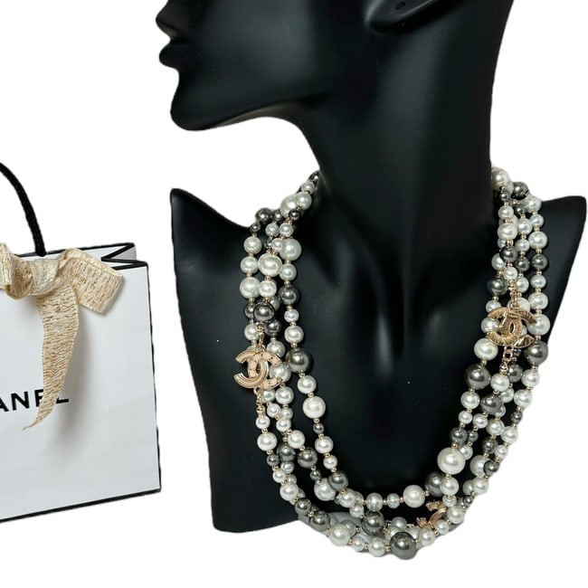 CHANEL White/Grey & Gold Pearl CC Logo Beaute Necklace Or Wrap Around Bracelet: • CHANEL • L.A. Collection • Necklace Or Wrap Around Bracelet (Can Be Worn Numerous Different Styles Both Ways) • Gold Tone Hardware • White Pearl Accents • Grey Pearl Ac