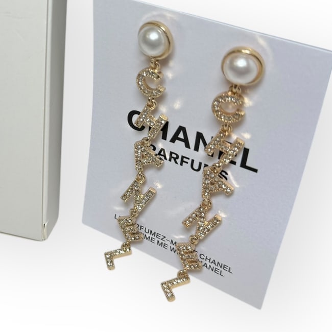 CHANEL Earrings Pearl/Rhinestone Logo Drop Earrngs & Original Gift Bag: • CHANEL • Earrings • Style: Drop • Gold Tone Hardware • Pearl Accent • Rhinestone CHANEL Logo • Gabrielle • L.A. Collection