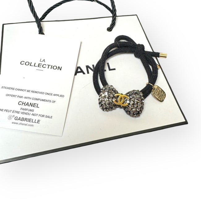 CHANEL Silver Rhinestone Gold CC Hair Bow Shaped L.A Collection Hair Tie: • CHANEL • L.A. Collection • Gabrielle • Hair Tie • Silver Rhinestone Covered • Hair Bow Shaped • Gold CC Logo • Unopened/In Original Packaging • CHANEL Gi