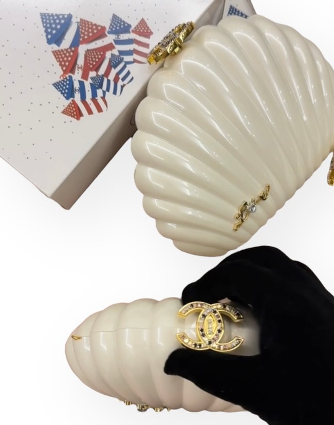 CHANEL Lim Ed White/Rhinestone Logo Airline Collection Shell Clutch Beaute Bag & Box: • Chanel • White • Gold Tone Hardware • Front Gold Tone Rhinestone Love Detail • Rhinestone CC Logo • Limited Edition Airline Collection • Shell Clutch • Intert