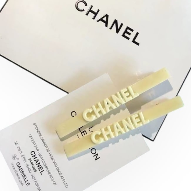 CHANEL 2Pc White CHANEL Logo L.A Collection Long Skinny Rectangle Hair Clips: • CHANEL • Gabrielle • Hair Clips • 2Pc Set • White • CHANEL Logo • Shape: Long Skinny Rectangle • Gold Tone Hardware • L.A Collection • Unopened/In O