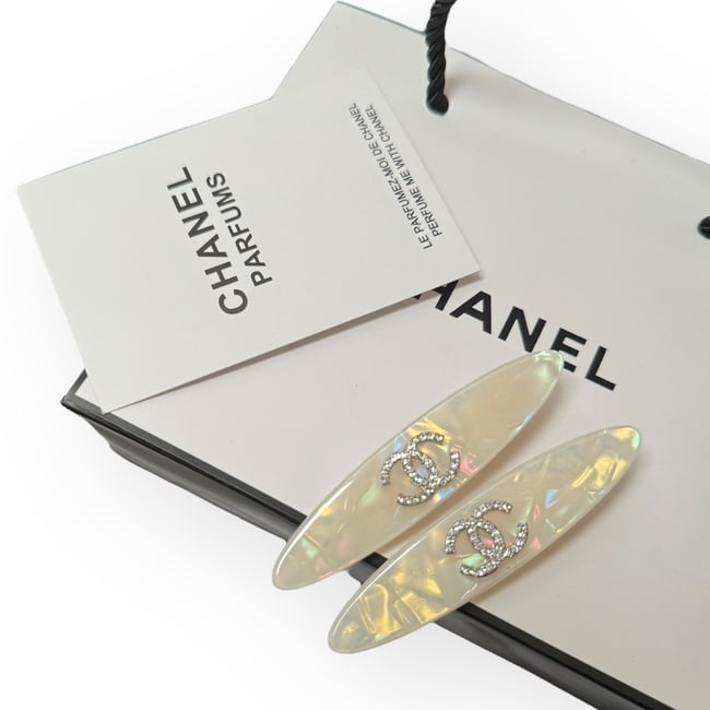 CHANEL 2Pc Set White Opal/White Rhinestone CC Logo Long Oval L.A Collection Hair Clips: • CHANEL • L.A. Collection • Gabrielle • 2Pc Set • White Opal • Hair Clips • Shape: Long Oval • White Rhinestone CC Logo • Gold Tone Hardware • Unopen