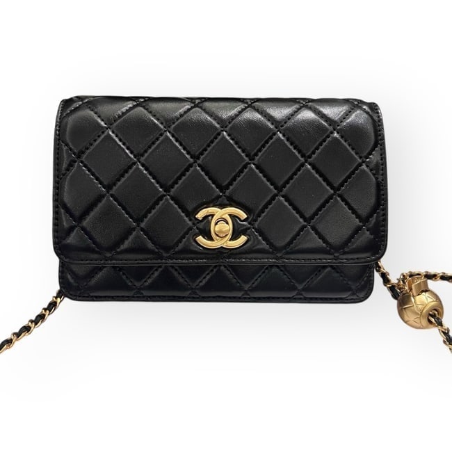 CHANEL Black/Gold Wallet On Chain W/ Ball Accents Beaute Bag & Original Box: • CHANEL • Black • Original Box Included • Quilted Pattern • Gold Tone Hardware • Wallet On Chain (WOC) • Intertwined Leather Chain Strap • Gold Ball Strap Deta