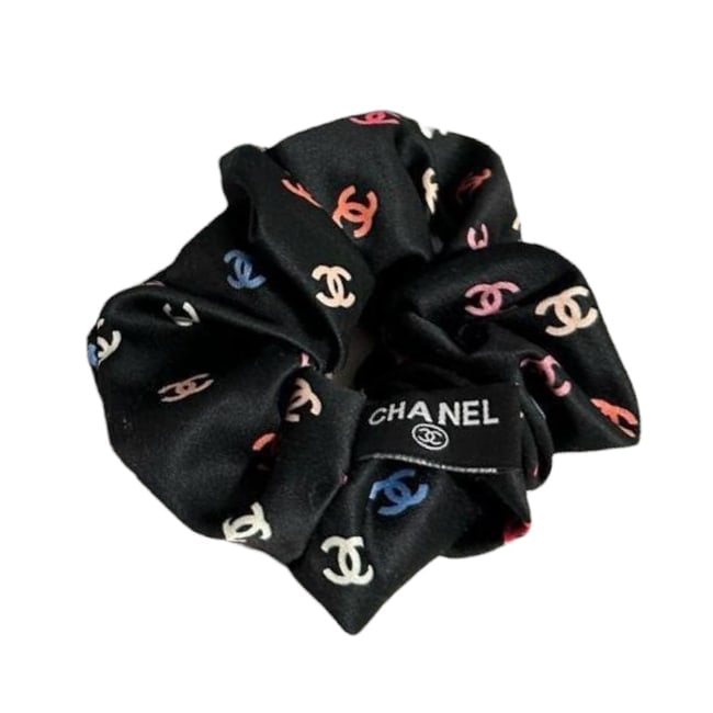 CHANEL Black/Multicolor Logo Beaute Hair Scrunchy: • CHANEL • Hair Scrunchy/Tie • Black • Multicolor CC Logo • Makeup/Diffusion Line: Please note that gwp/beaute items are not sold in boutique stores & some item's do not have