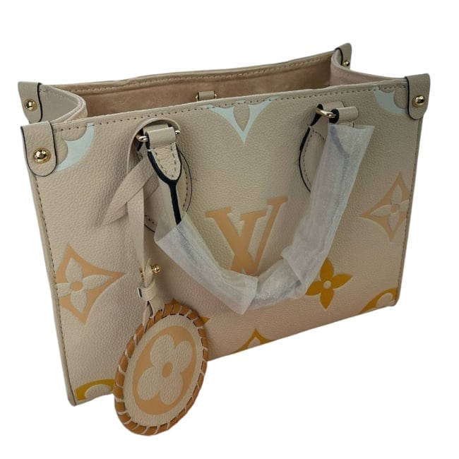 Louis Vuitton Creme/Orange Gradient OnTheGo PM Beaute Bag & Original Box: • Louis Vuitton • OnTheGo PM • Tote• Creme • Orange Gradient Accents • Double Handles • Removable Strap Included • Gold Tone Hardware • Interior Zip Pocket