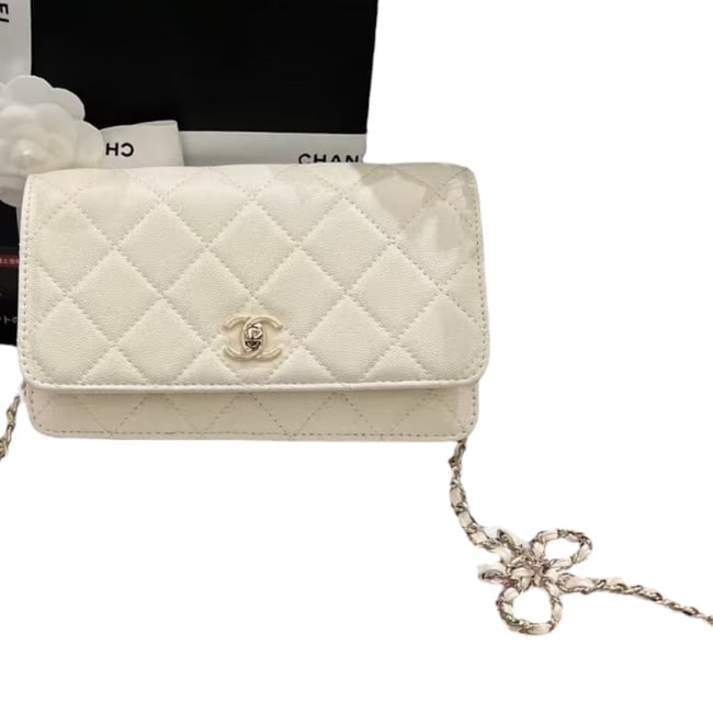 CHANEL White/Silver Wallet On Chain Bow Strap Beaute Bag & Original Box: • CHANEL • White • Quilted Pattern • Wallet On Chain (WOC) • Bow Accented Shoulder Strap • Silver Tone Hardware • Intertwined Leather Chain Strap • Signature Tw