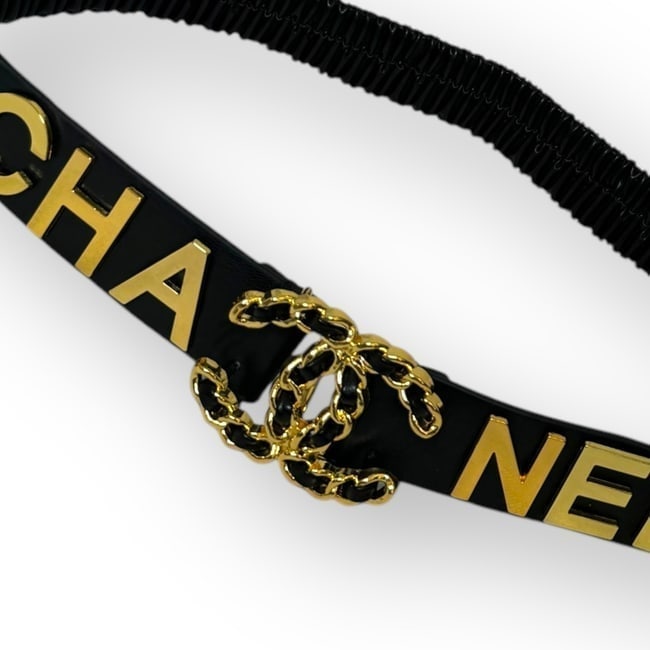 CHANEL Intertwined Front CC Beaute Belt & Box: • CHANEL • L.A. Collection • Belt • Black • Gold Tone Hardware • Stretchy/One Size Fits All • Front Intertwined CC Logo • Front CHANEL Logo • Makeup/Diffus