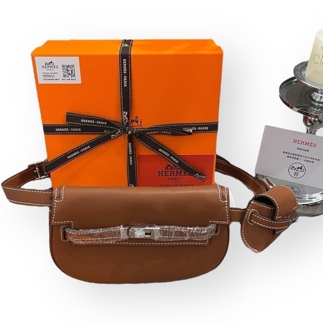 Hermes Brown/Silver Kelly Moove Belt Beaute Bag, Pouch, & Original Box: • Hermes • Kelly Moove • Belt Bag • Adjustable Single Strap • Side Pouch • Waist or Shoulder Carry • Signature Turn Lock Closure • Silver Tone Hardware • I