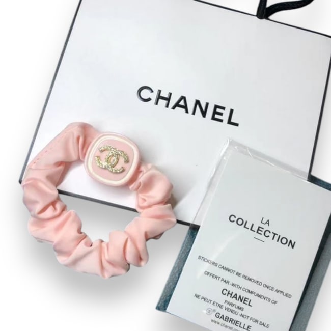 CHANEL Pink/White CC Rhinestone CC Hair Scrunchy & Gift Bag: • CHANEL • Pink • Shape: Square • Gabriella • L.A Collection • Scrunchy • White Trim • White Rhinestone Covered CHANEL Logo • Unopened/In Original Packagin
