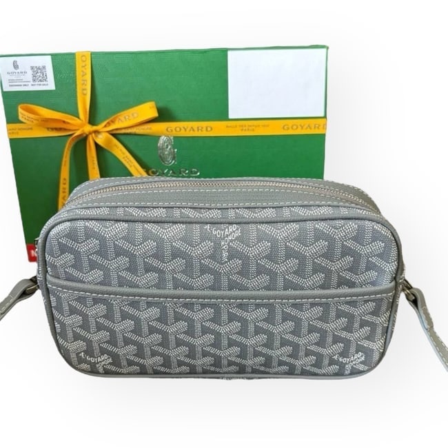 Goyard Cap Vert Blue Crossbody Beaute Bag & Original Box: • Goyard • Cap Vert • Crossbody Or Shoulder Carry • Front Logo • Blue • Exterior Rear Slip Pocket • Zip Closure • Silver Tone Hardware • Interior Sli