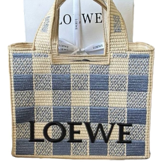 Loewe Woven/Blue Front Logo 2Way Carry Beaute Tote: • Loewe • Tote • Woven • Blue Accents • Double Handles • Front Logo • Gold Tone Hardware • Interior Zip Pocket • Interior Slip Pocket • R