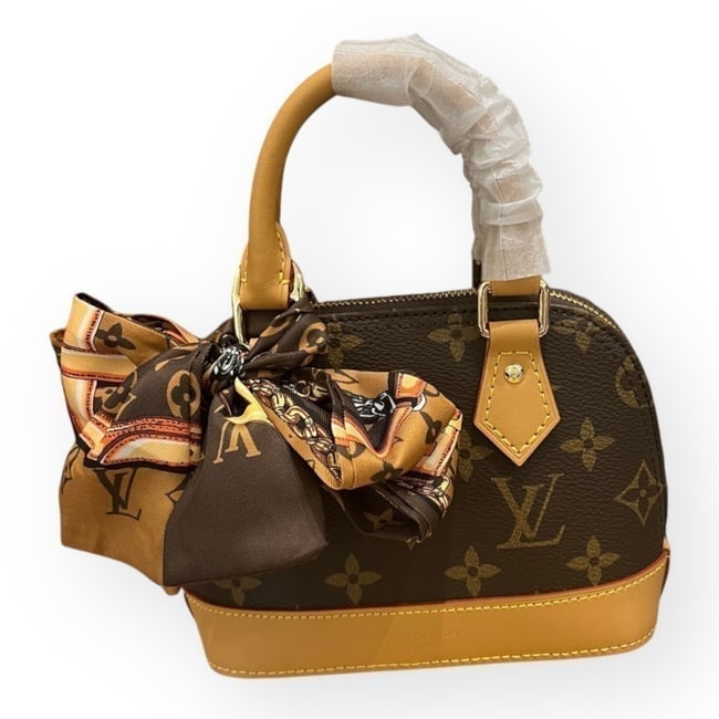 Louis Vuitton Alma Monogram Nano 2Way Carry Beaute Bag & Box: • Louis Vuitton • Monogram • Brown • Alma Nano • Double Handles • Gold Tone Hardware • Single/Removable Shoulder Strap Included • Top Handle Or Shoulder Carry &
