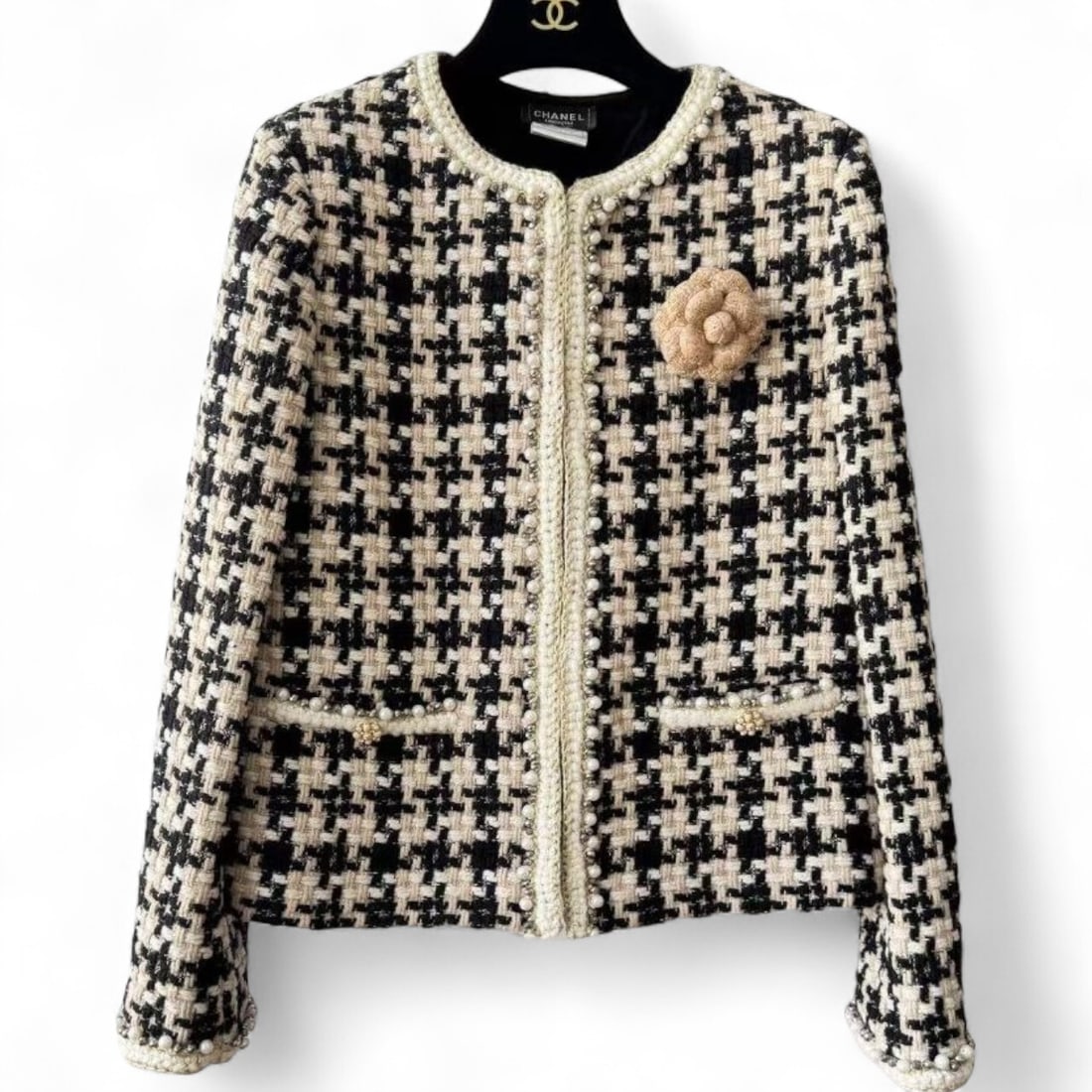 CHANEL Black & Beige/Pearl & Floral Detailed Button Up U.L Long Sleeve Jacket: • CHANEL • Women’s • Uniform Line • Beige & Black • White Accents • Pearl Details • Floral Detail • Long Sleeve • Button Up • Front Pockets •