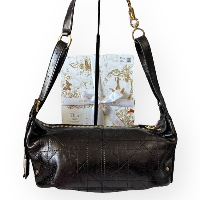 Christian DIOR Black/Gold D-Journey Beaute Bag & Original Gift Bag: • Christian DIOR • D-Journey • Black • Gold Tone Hardware • Adjustable Straps • Zip Closure • Interior Zip Pocket • Interior Slip Pocket • Cannage Pa