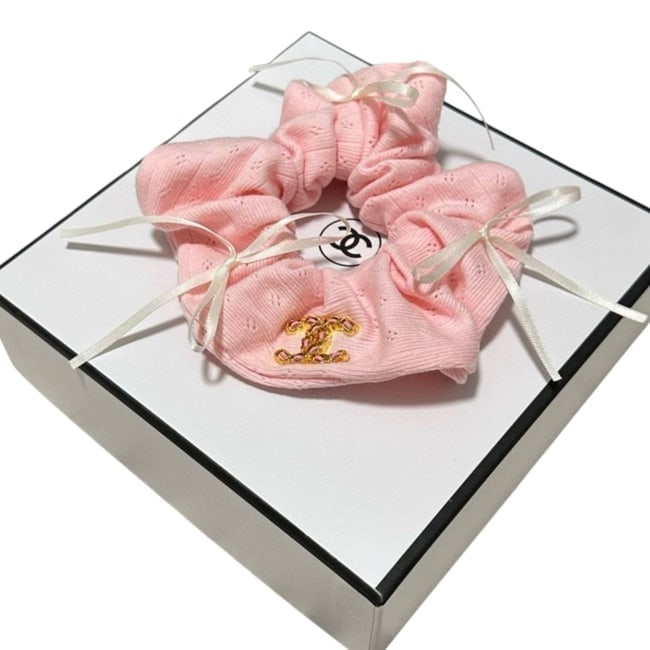 CHANEL Pink/Gold Ribbon Detailed Beaute Hair Scrunchy & Gift Bag: • CHANEL • Hair Scrunchy • Pink • Gold Tone Hardware • Intertwined Front CC Logo • Ribbon Detail • Original Gift Bag Included