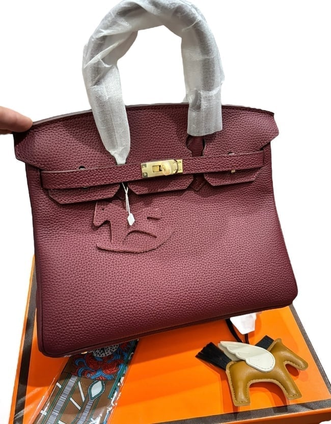 Hermes Berry/Gold Birkin Beaute Bag, Keys, & Original Box: • Hermes • Berry • Top Handle Or Shoulder Carry • Birkin Bag • Signature Front Twist Closure • Gold Tone Hardware • Zip Closure On Sides • Interior Slip Pocket