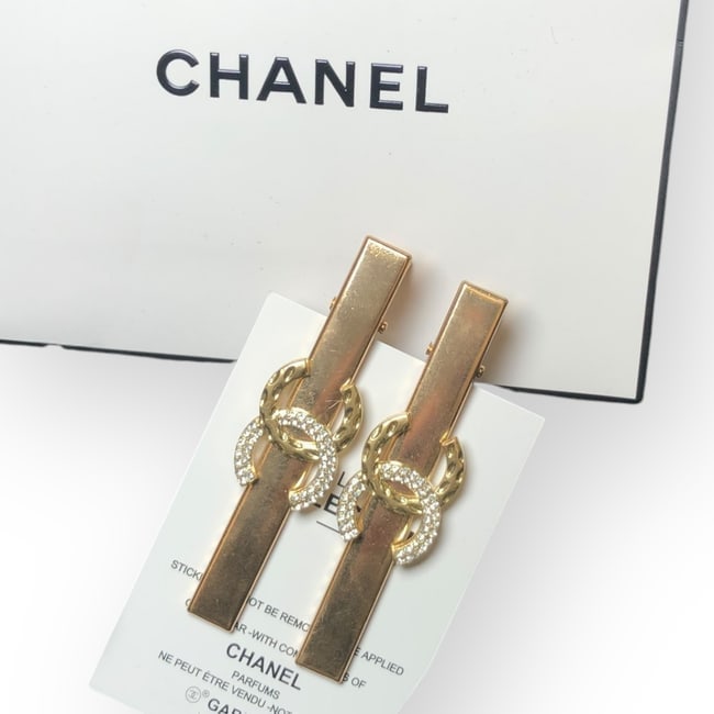 CHANEL 2Pc Lg Gold/Rhinestone CC Hair Clips & Gift Bag: • CHANEL • 2Pc Set • Gabrielle • Lg Hair Clips • Shape: Long Rectangle • White Rhinestone/Detailed CC Logo • L.A Collection • Original Gift Bag Included