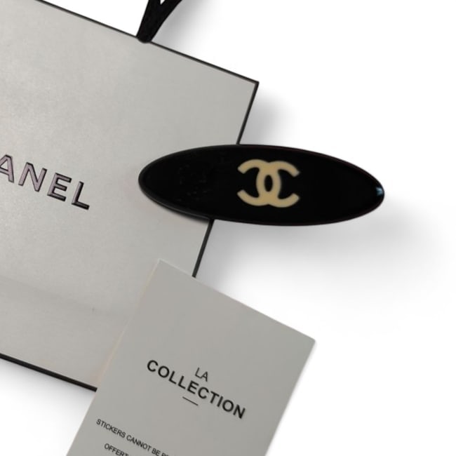 CHANEL Black/Front CC Long Oval Beaute Hair Clip & Gift Bag: • CHANEL • Gabrielle • Hair Clip • Black • CC Logo • Silver Tone Hardware • Shape: Lg Long Oval • L.A Collection • Original Gift Bag Included