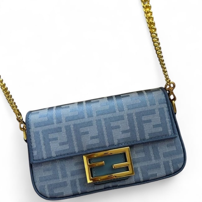 Fendi Blue & Gold Signature Print Baguette Beaute Bag & Original Box: • Fendi • Style: Baguette • Color: Blue • Pattern: Signature Print • Hardware: Gold Tone • Straps: Removable Strap For Top Handle Carry Included, Removable Mini Chain Lin