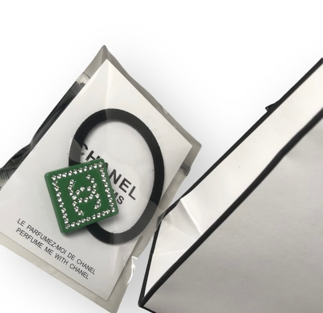 CHANEL Green/White Rhinestone Square Hair Tie & Gift Bag: • CHANEL • L.A. Collection • Gabrielle • Green • White Rhinestone Front CC Logo • White Rhinestone Trim • Hair Tie • Shape: Square • Original Gift Bag