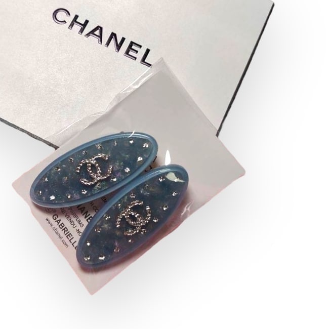 CHANEL 2Pc Blue/White Rhinestone CC Logo Beaute Hair Clips & Gift Bag: • CHANEL • Gabrielle • Hair Clips • 2Pc Set • Pearl Blue • Rhinestone CC Logo • Rhinestone Accents • Shape: Oval • L.A Collection • Unopened/In Or