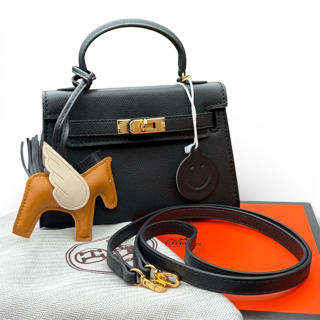 Hermes Black/Gold Mini Kelly Birkin Beaute Bag & Original Box: • Hermes • Epsom Sellier Pattern • Black • Gold Tone Hardware • Signature Twist Lock Closure • Original Box Included • Top Handle Carry • Removable Strap For Op