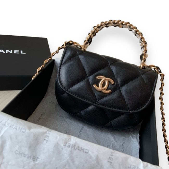CHANEL Black Quilted Mini Pearl Half Moon Beaute Bag & Original Box: • CHANEL • Half Moon • Pearl Accented Top Handle • Black • Quilted Pattern • Gold Tone Hardware • Front CC Logo • Single Strap • Intertwined Chain Strap &b