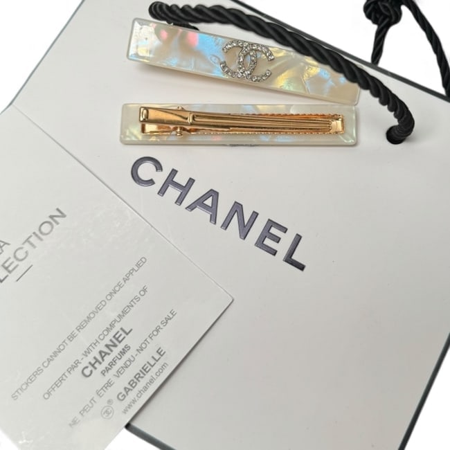 CHANEL2Pc Lg White Opal/Rhinestone CC Rectangle Hair Clips & Gift Bag: • CHANEL • L.A. Collection • Gabrielle • 2Pc Set • Hair Clips • White Opal • Rhinestone CC Logo • Gold Tone Hardware • Shape: Long Rectangle • Size: