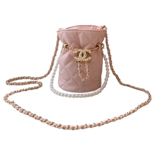 CHANEL Pink/Gold Mini Drawstring Beaute Bag & Original Box: • CHANEL • Pink • Quilted Pattern • Gold Tone Hardware • Mini Drawstring Bag • Drawstring Closure • Beveled CC Logo Charm On Strap • Removable Pearl Strap &bull
