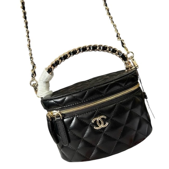 CHANEL Black Round Vanity Beaute Case W Top Handle & Original Box: • CHANEL • Vanity Case • Shape: Round • Black • Quilted Pattern • Gold Tone Hardware • Removable Intertwined Leather Chain Strap • Zip Closure • Top Handle