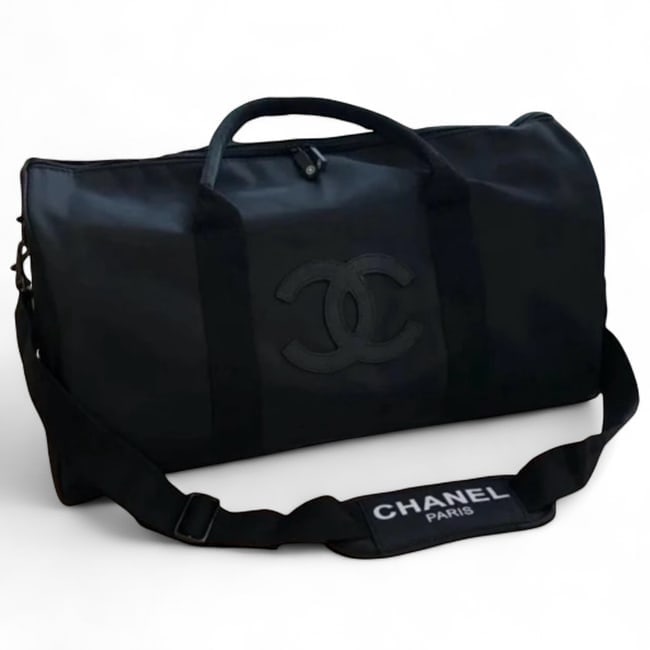 CHANEL Black/Black Front Logo Duffel Beaute Bag: • CHANEL • Duffel Bag • Certificate Of Authenticity Included • Black • Black & White Accents • Removable Strap Included • Top Handle For Optional Carry • Double