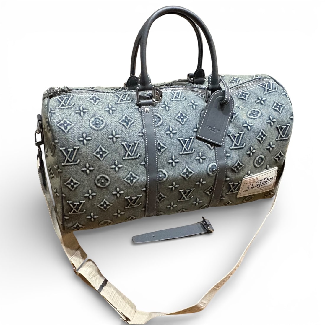 Louis Vuitton Denim/Monogram Keepall 50 Beaute Bag & Orig Gift Bag: • Louis Vuitton • Keepall 50 • Style: Duffel/Travel Bag 55 • Denim • Pattern: Monogram • Trim/Accents: Blue • Accessories Included: Removable Strap, Matching Bag Tag