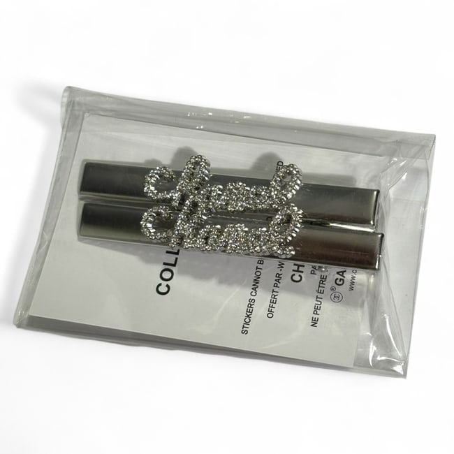 CHANEL 2Pc Lg Silver/Rhinestone Logo Long Rectangle Hair Clips & Gift Bag: • CHANEL • L.A. Collection • Gabrielle • 2Pc Set • Hair Clips • White Rhinestone CHANEL Logo • Silver Tone Hardware • Shape: Long Rectangle • Size: L