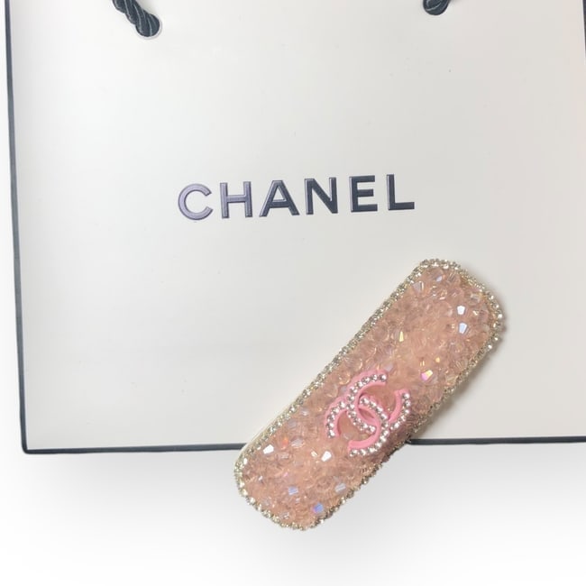 CHANEL Pink/White Crystals & Rhinestone CC Long Oval Hair Clip & Gift Bag: • CHANEL • Style: Gabrielle • Type: Hair Clip • Accents: Pink Crystals • Logo: Pink/White Rhinestone CC • Trim: White Rhinestone Trim • Size: Large • Collection